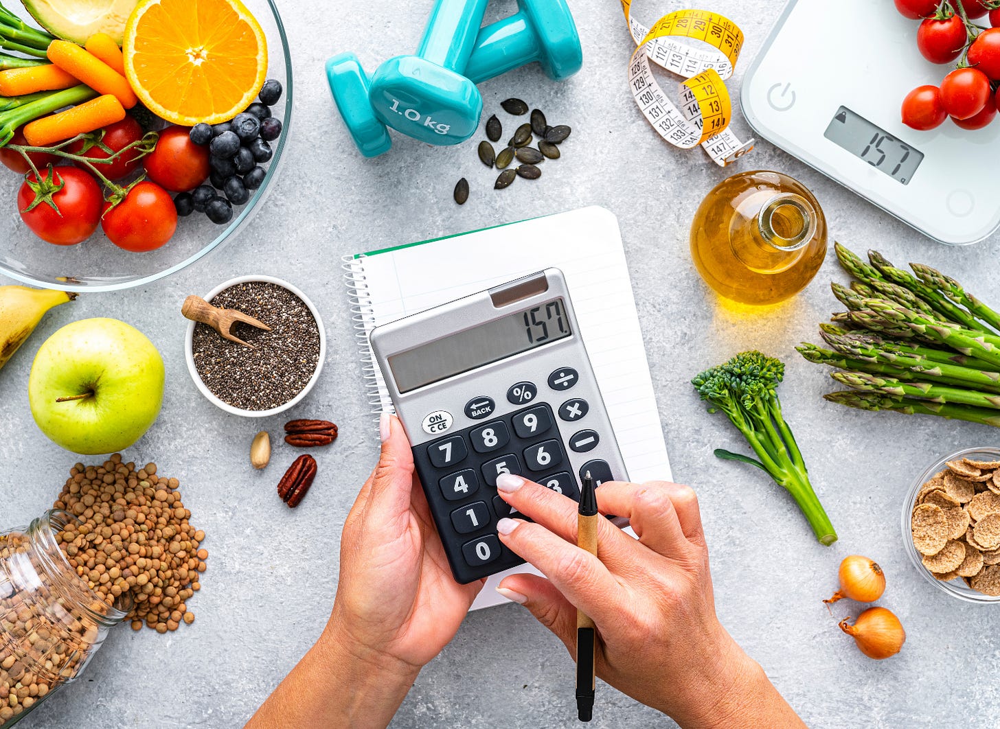 woman calculating how many calories to eat to lose weight