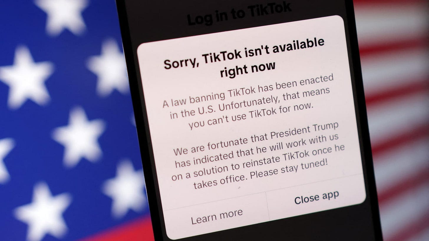 The U.S. flag and TikTok app with the message "Sorry, TikTok isn't available right now" are seen in this illustration taken, January 19, 2025. REUTERS/Dado Ruvic/Illustration