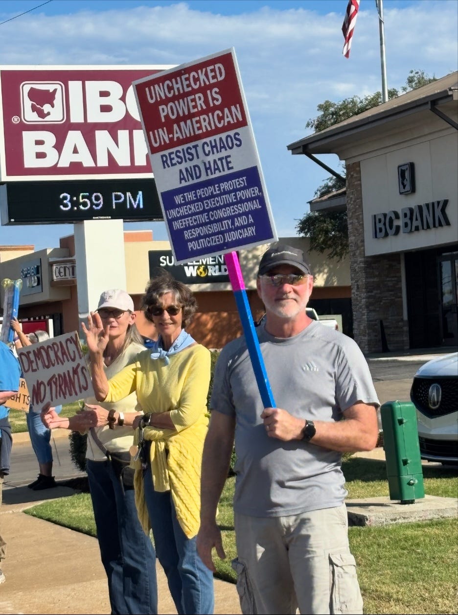 A group of people holding signs

AI-generated content may be incorrect.