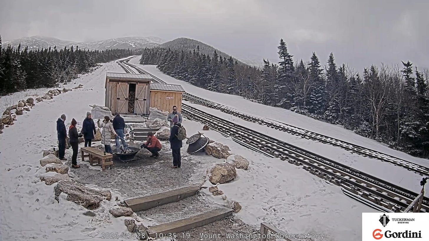 May be an image of train, snowplow, ski slope, lumberyard and text