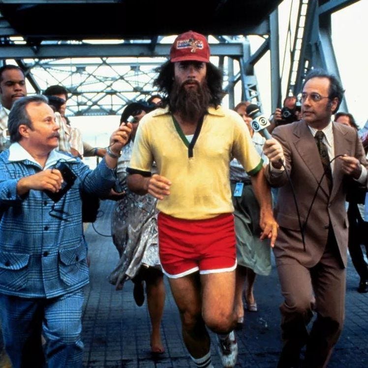 movie still from Forrest Gump with him running and news reporters following movie still from Forrest Gump with him running and news reporters following
