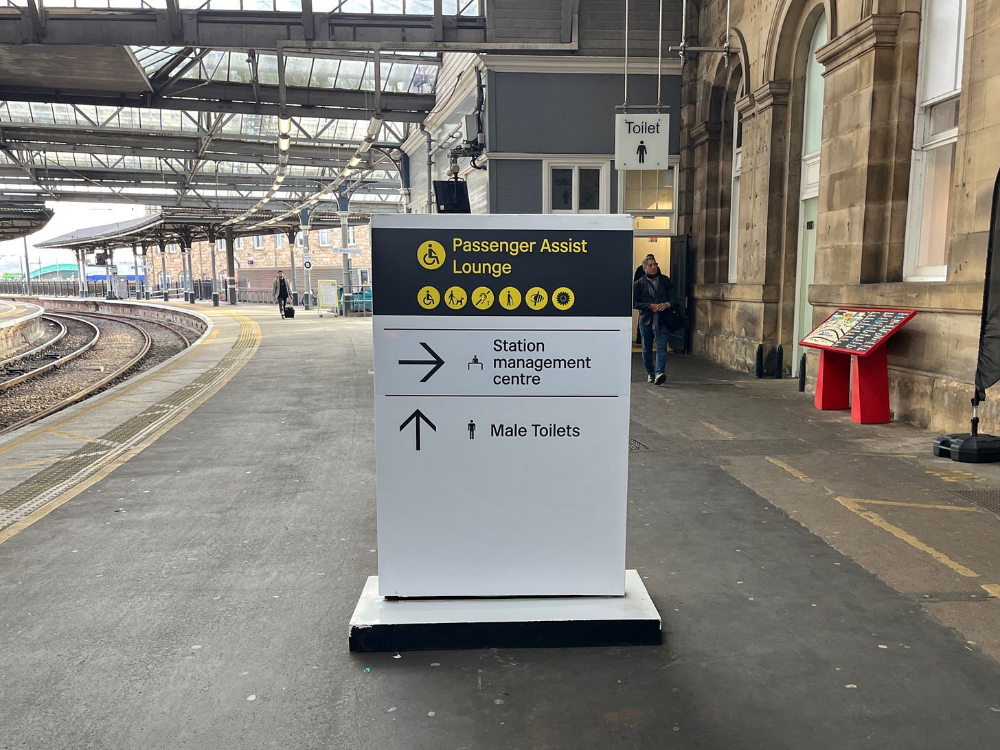 Photo of a totem wayfinding sign at Newcastle station.