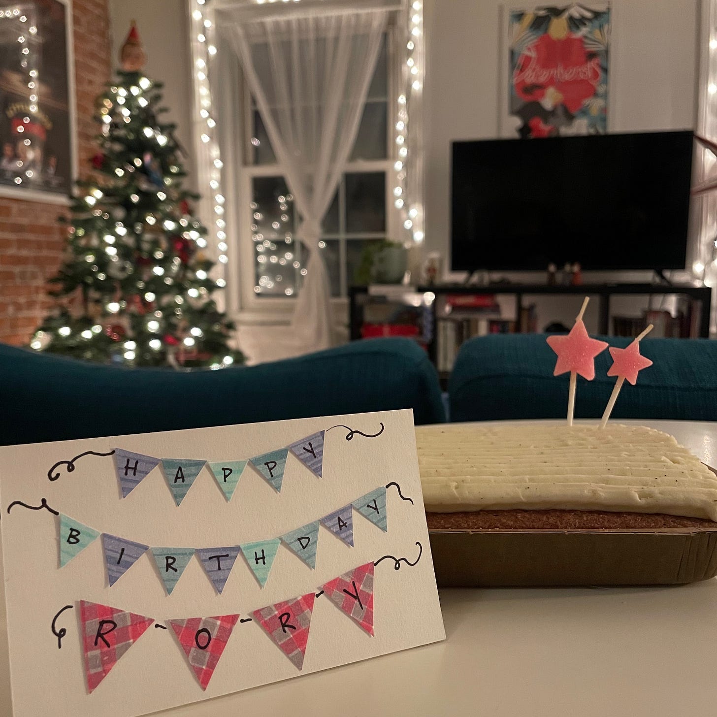 a cake with a sign that says "happy birthday, Rory!"