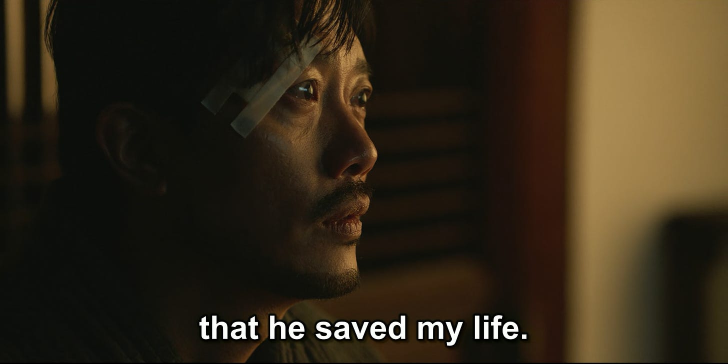 Choi Mu-jin at the temple speaking to Yoon Ji-woo, episode six of My Name (2021) with the line "that he saved my life."