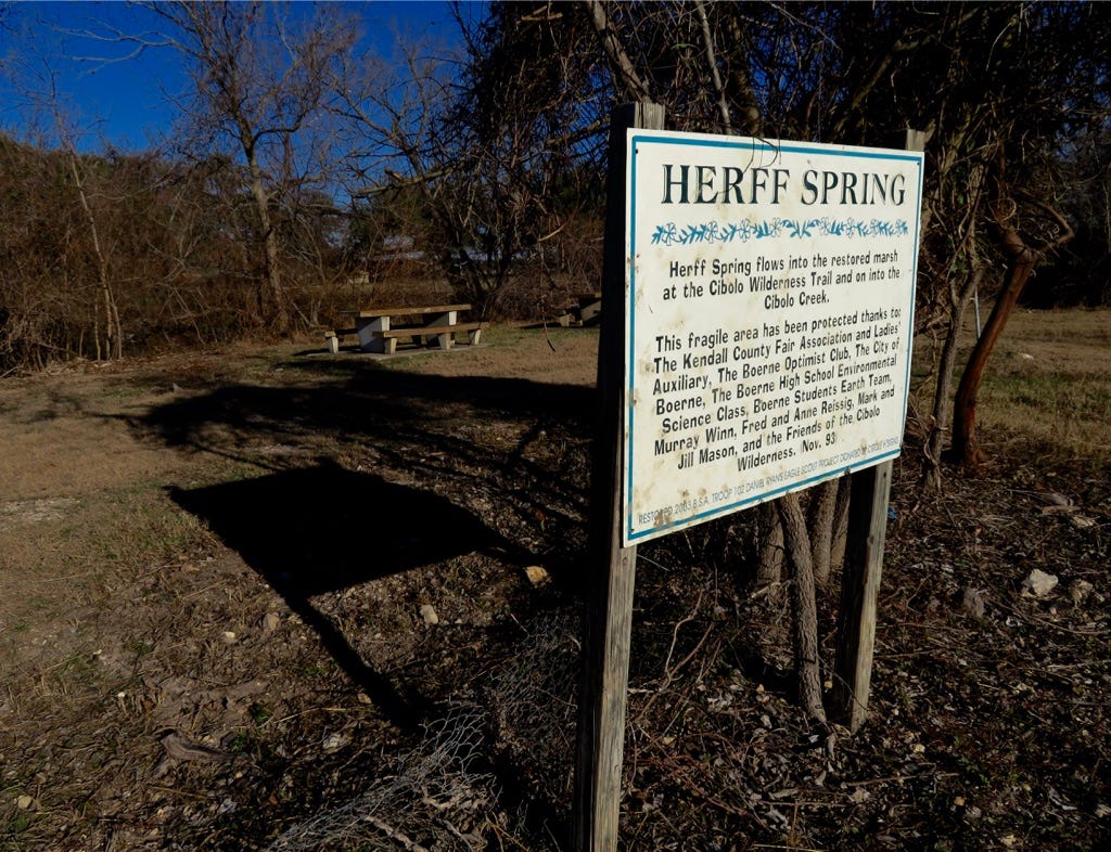 A sign in the woods

Description automatically generated