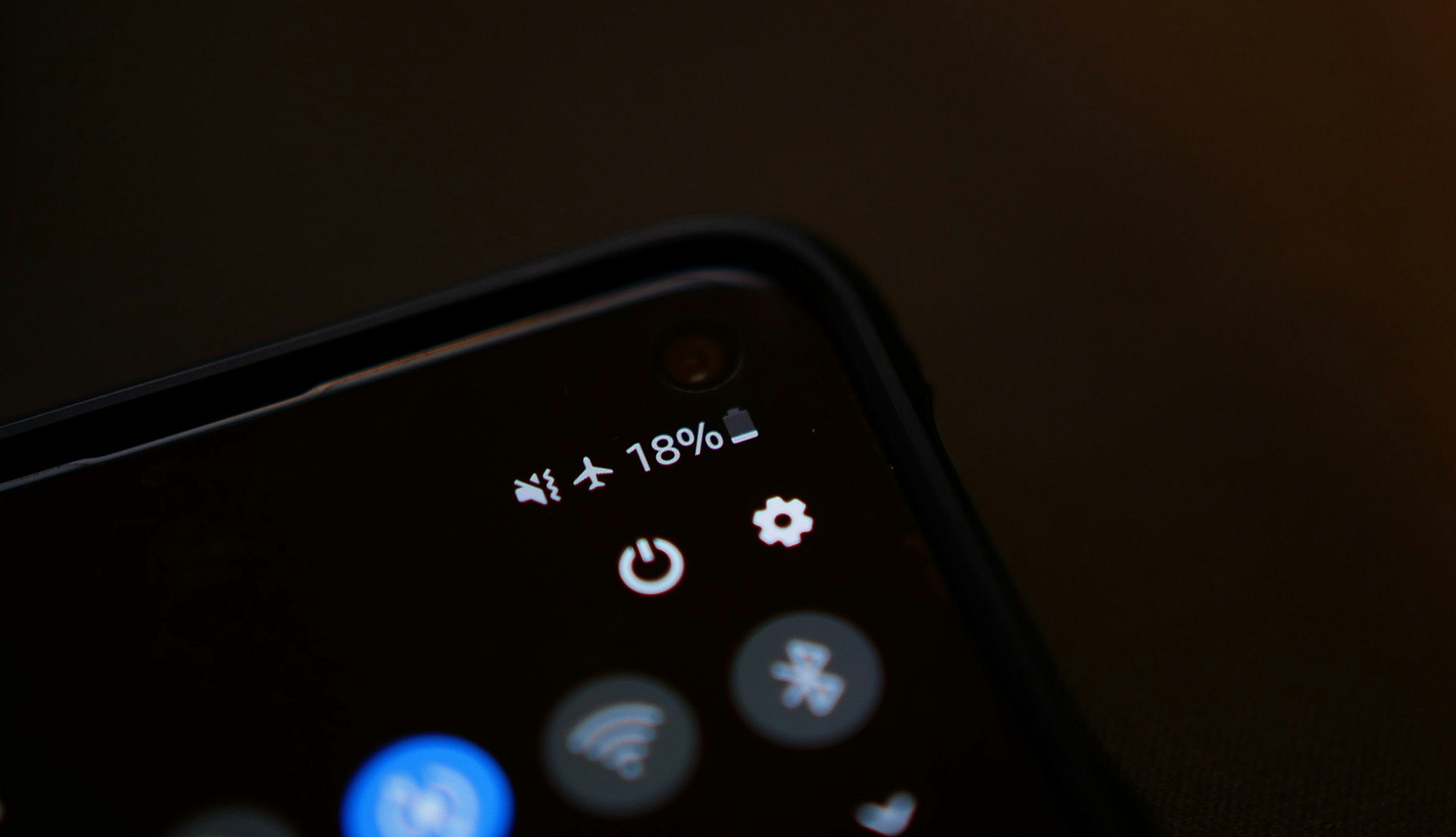 Image shows a corner of a mobile phone and the battery at 18% Image shows a corner of a mobile phone and the battery at 18%