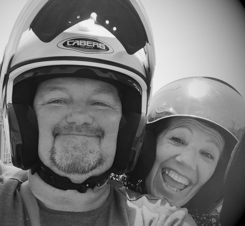 Couple having fun on a motorbike