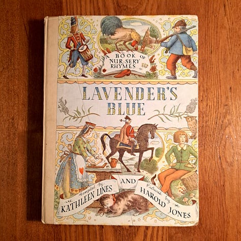 six childhood books set against wood or dark cloth