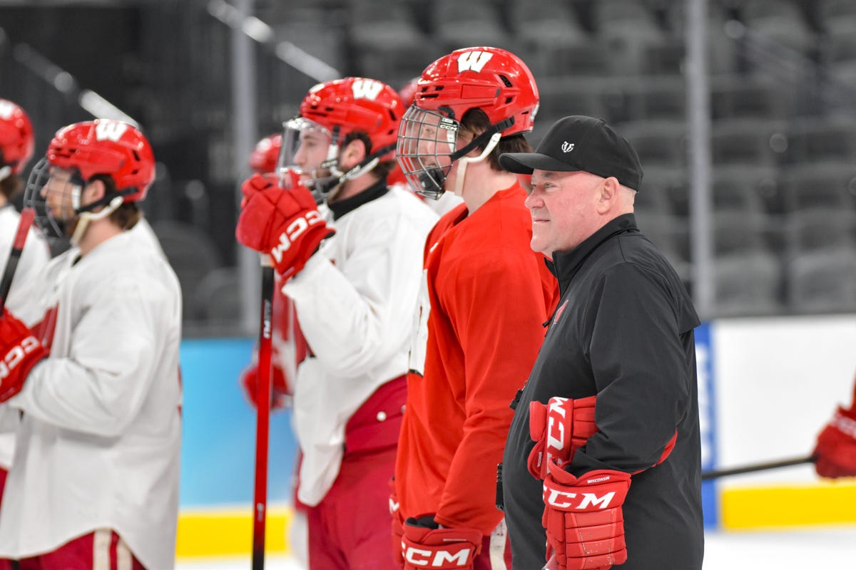 Head Coach Mike Hastings Quinn Finley red practice jersey