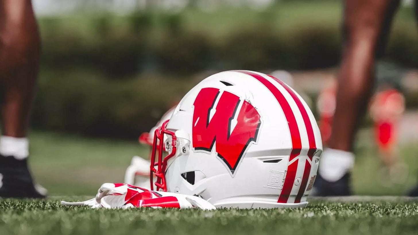 Wisconsin Badgers football helmet laying on the field. Photo credit: UW Athletics