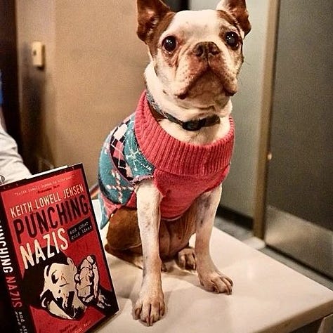 My book laying open atop a sleeping baby, my book next to a cute dog, and me reading me book at a bookstore event
