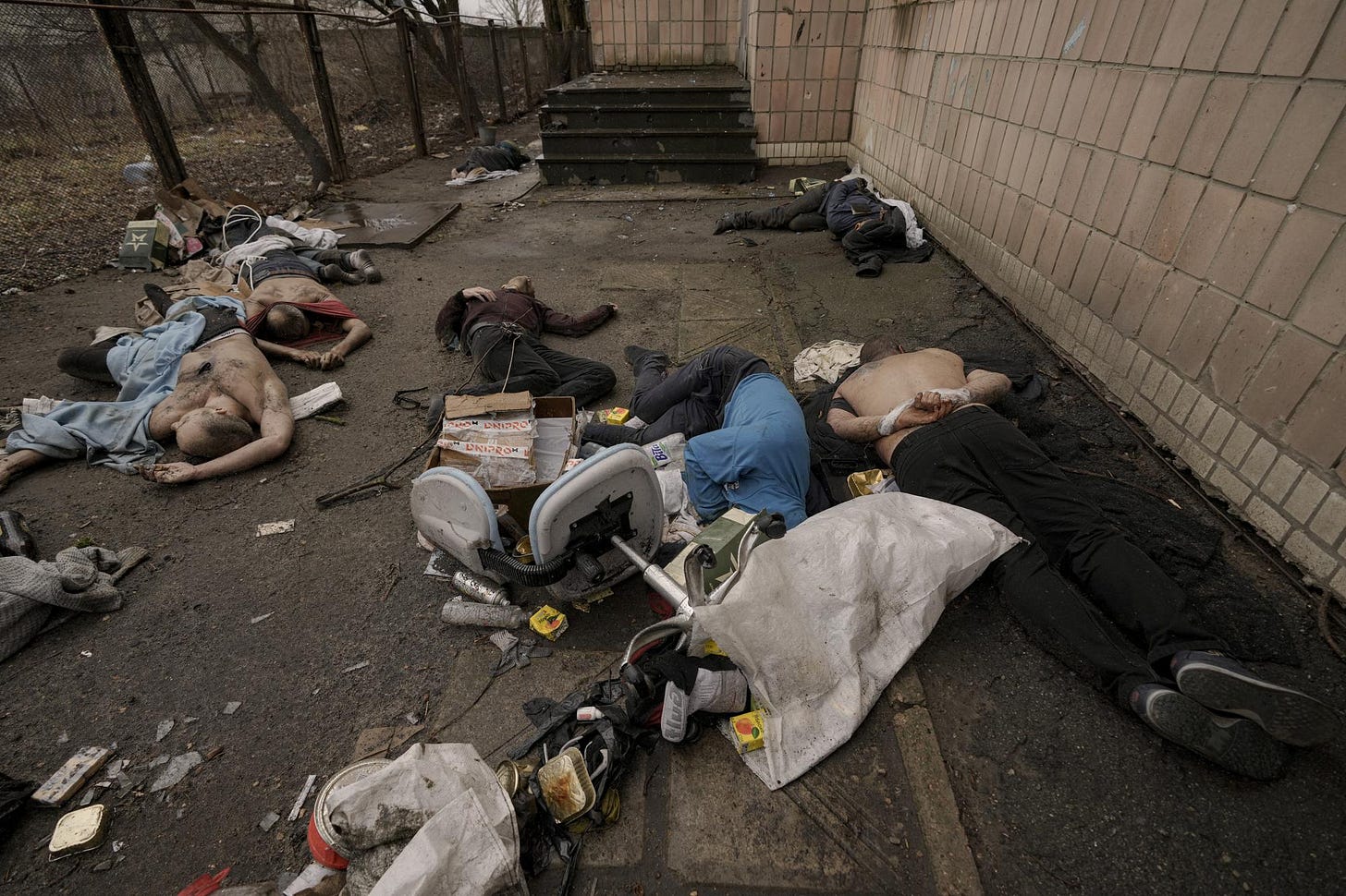 EDS NOTE: GRAPHIC CONTENT - FILE - Lifeless bodies of men, some with their hands tied behind their backs, lie on the ground in Bucha, Ukraine, Sunday, April 3, 2022. Russian soldiers picked up these men on March 4, 2022, as they swept the streets of Bucha to identify and neutralize potential threats. Ukrainian prosecutors now say they know who was responsible for the violence that day: Soldiers from the 76th Guards Airborne Assault Division, who ultimately reported up to Col. Gen. Alexander Chaiko, a man known for his brutality as leader of Russia’s troops in Syria. (AP Photo/Vadim Ghirda, File)