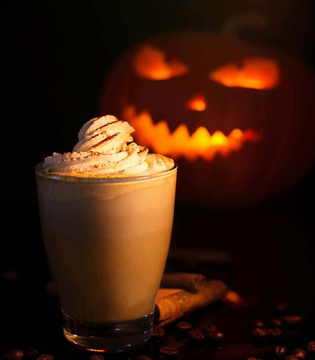 white and brown cupcake with jack o lantern
