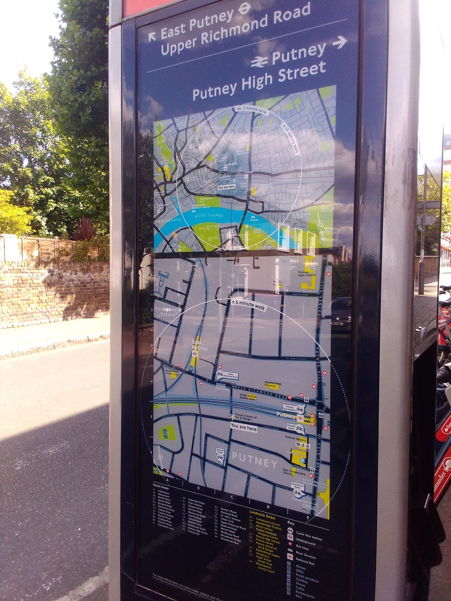A rectangular post with a map of Putney