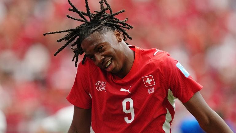 Johan Manzambi celebrates after doubling Switzerland's lead against Canada (Ethan Cairns/The Canadian Press via AP)