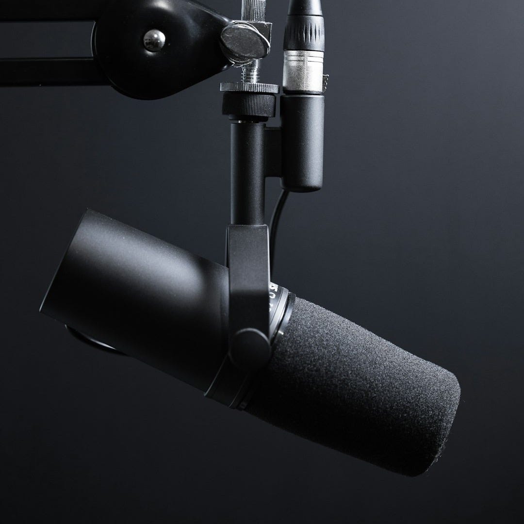 black and silver microphone with stand
