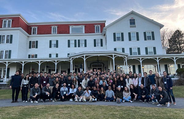 A group of people in front of a building