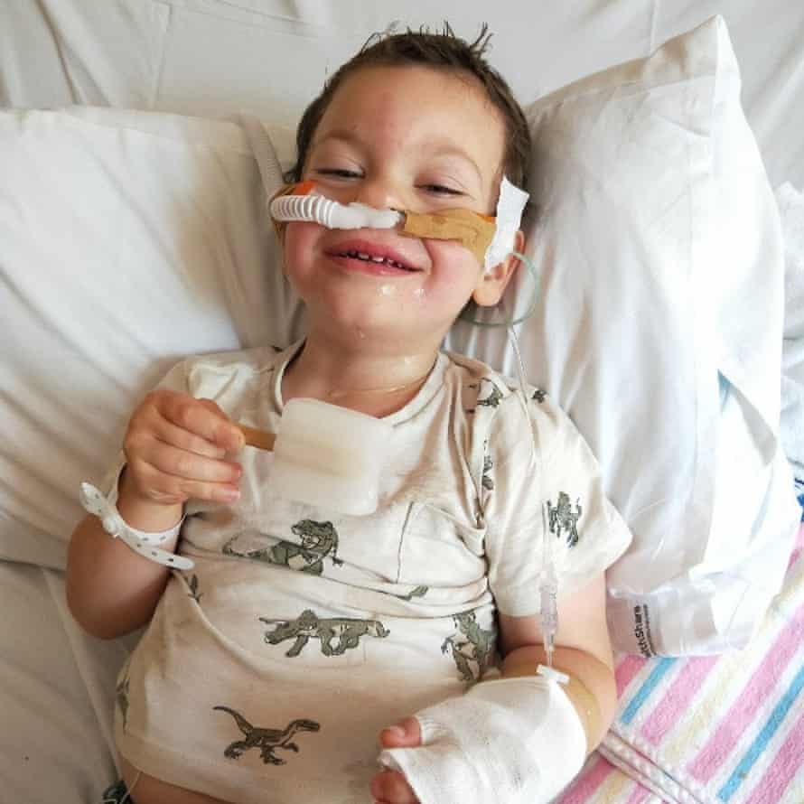 A young boy in a hospital bed A young boy in a hospital bed