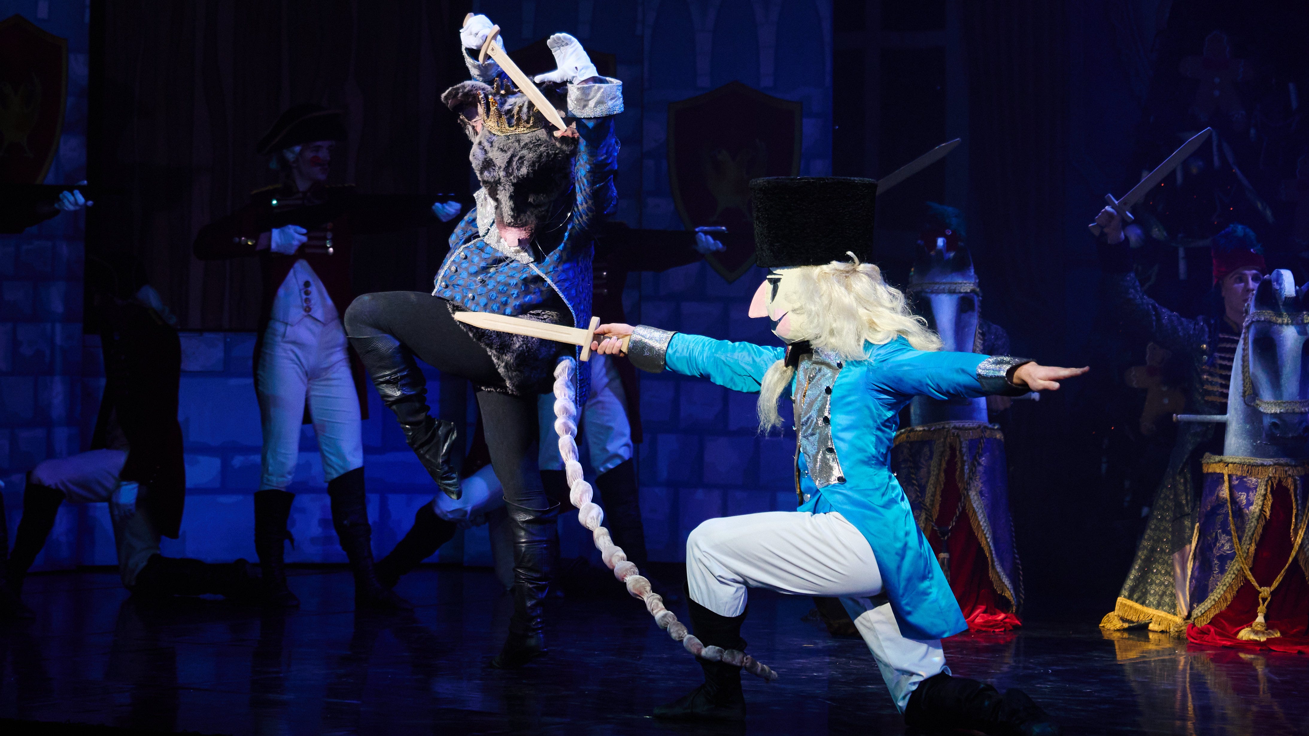 The mouse king wields his sword again a toy soldier wearing a vivid sky blue jacket in Northern Ballet's production of The Nutcracker.