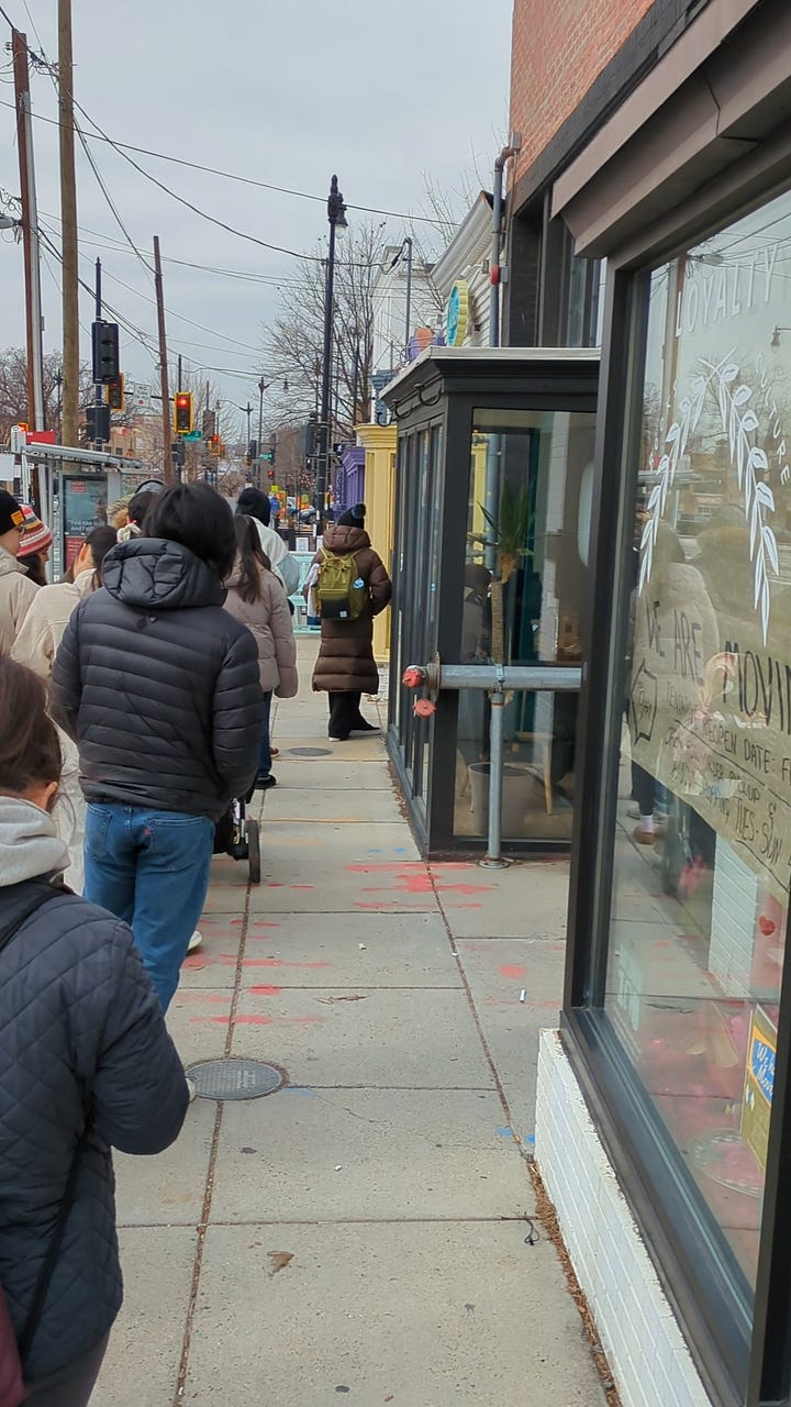 Line down the block on a tuesday at 11am and the subtle sign outside menya hosaki