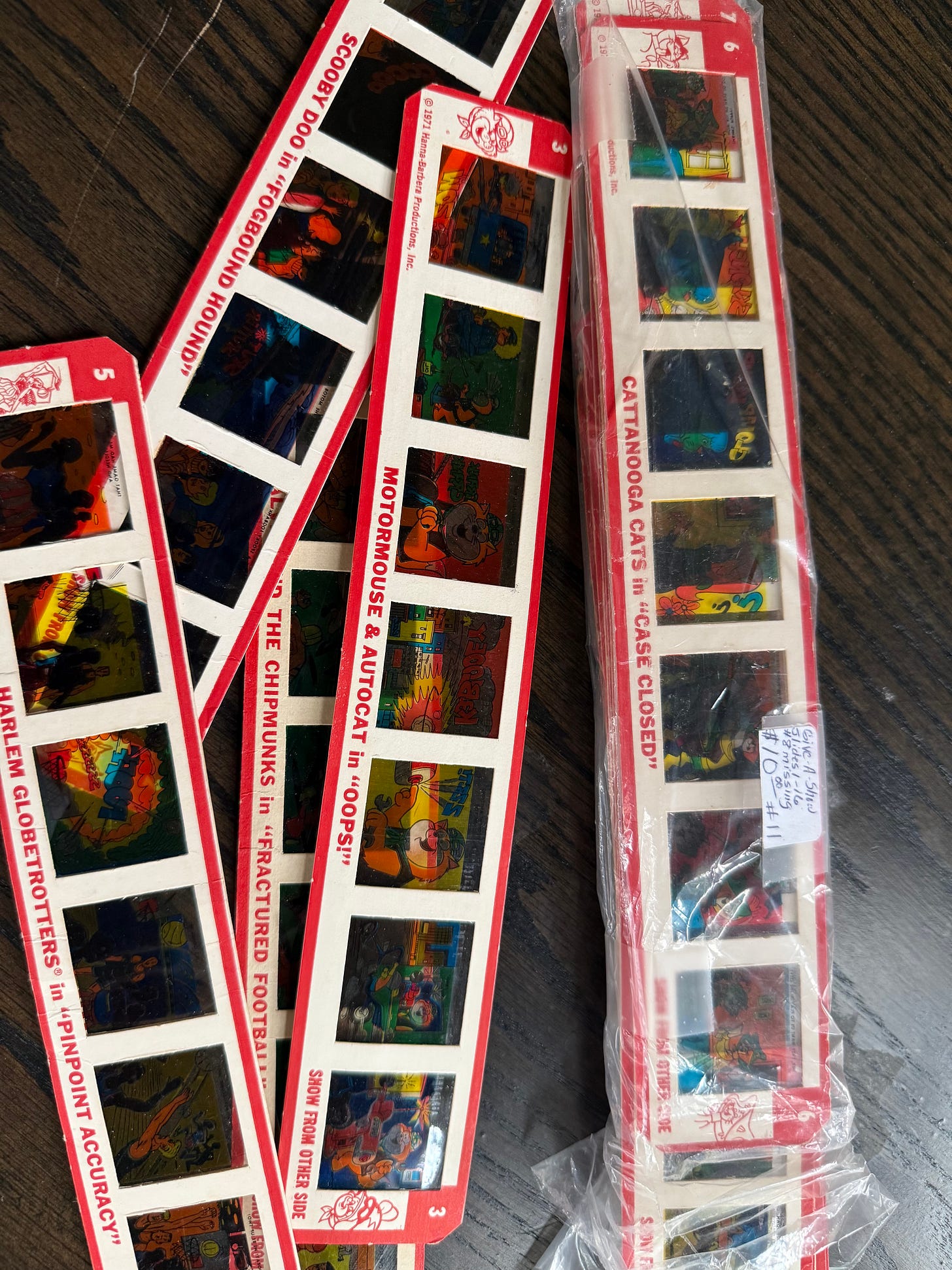 several cartoon film strips on a table several cartoon film strips on a table