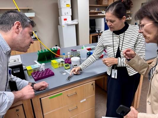 A group of people in a lab

AI-generated content may be incorrect.