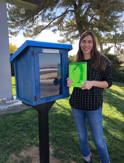 Teacher Lori Mann with her Little Free Library