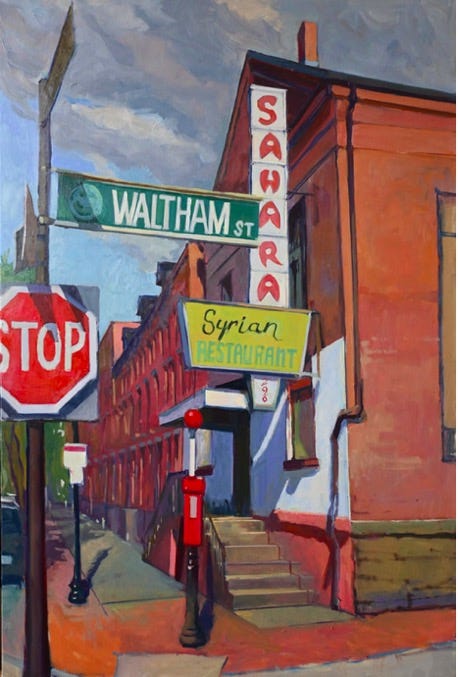 A street sign and stop sign

Description automatically generated