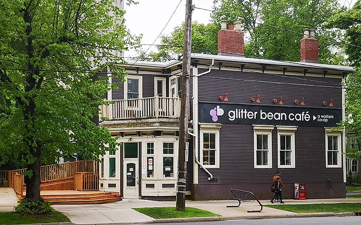 Picture of exterior of Glitter Bean Café with logo