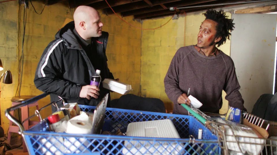 Andre Royo as Reginald 'Bubbles' Cousins standing in front of a full shopping cart next to Domenick Lombardozzi as Thomas 'Herc' Hauk in The Wire Andre Royo as Reginald 'Bubbles' Cousins standing in front of a full shopping cart next to Domenick Lombardozzi as Thomas 'Herc' Hauk in The Wire