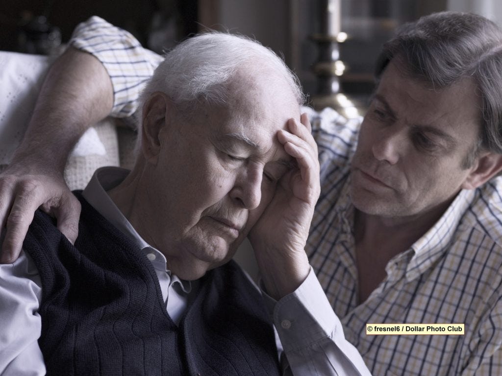 Portrait of an elderly man, comforted by his son Portrait of an elderly man, comforted by his son