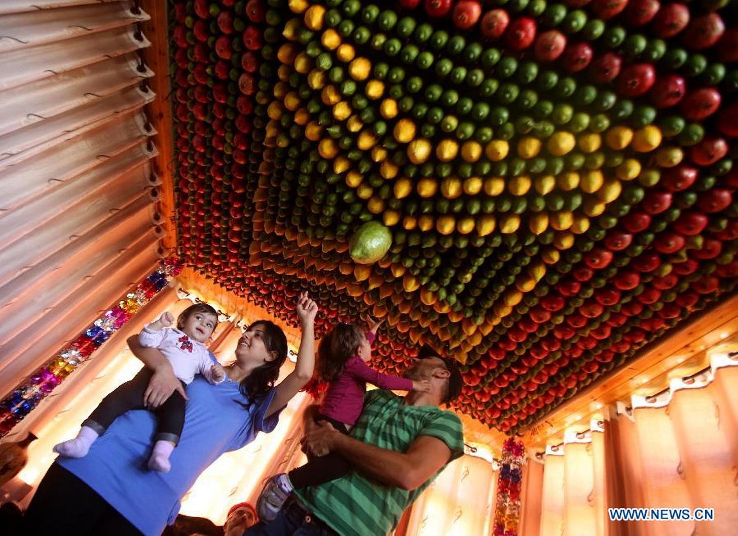 A Samaritan family celebrating Sukkot. Photo by Xinhua/Ayman Nobani