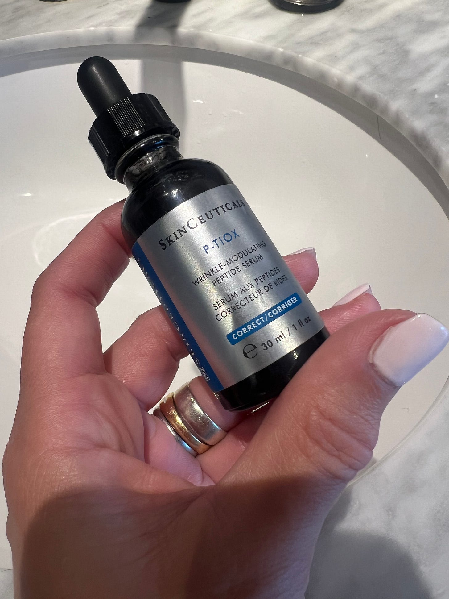 A bottle of SkinCeuticals P-TIOX Neuro-Peptide Serum, a advanced anti-aging formula formulated to target lines and deliver a glassy skin radiance. A bottle of SkinCeuticals P-TIOX Neuro-Peptide Serum, a advanced anti-aging formula formulated to target lines and deliver a glassy skin radiance.