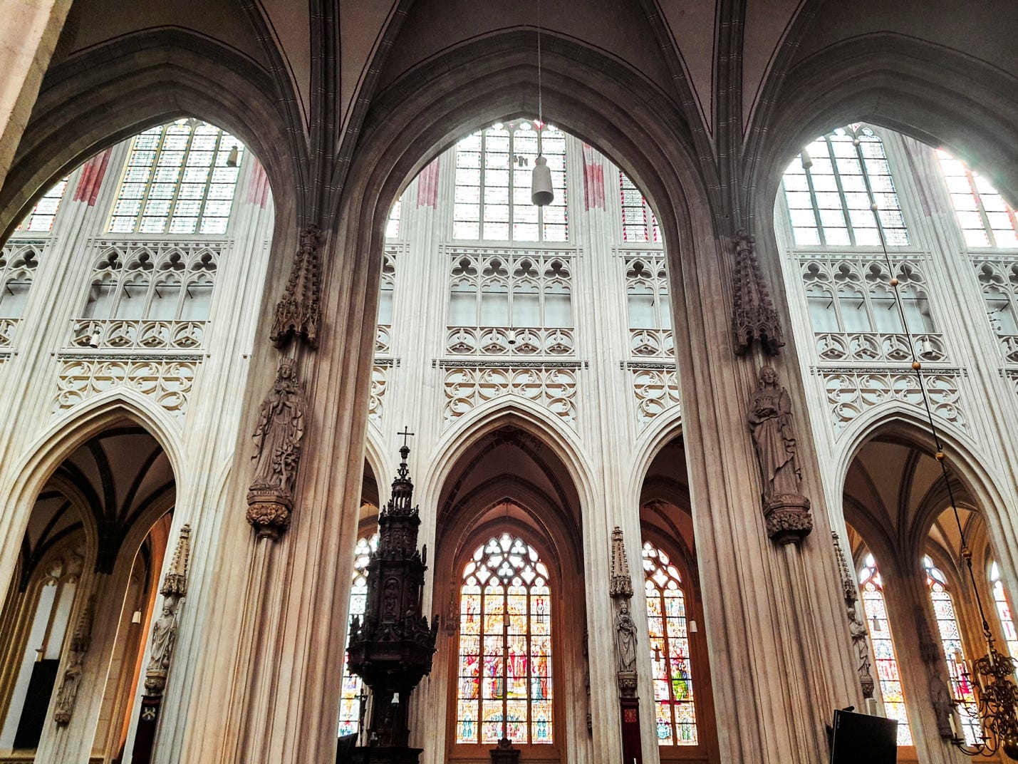 A large building with arched windows

AI-generated content may be incorrect.