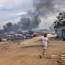 Running to a reinforced concrete shelter in Ashkelon, Israel, moments after a rocket siren was sounded on Oct. 7.