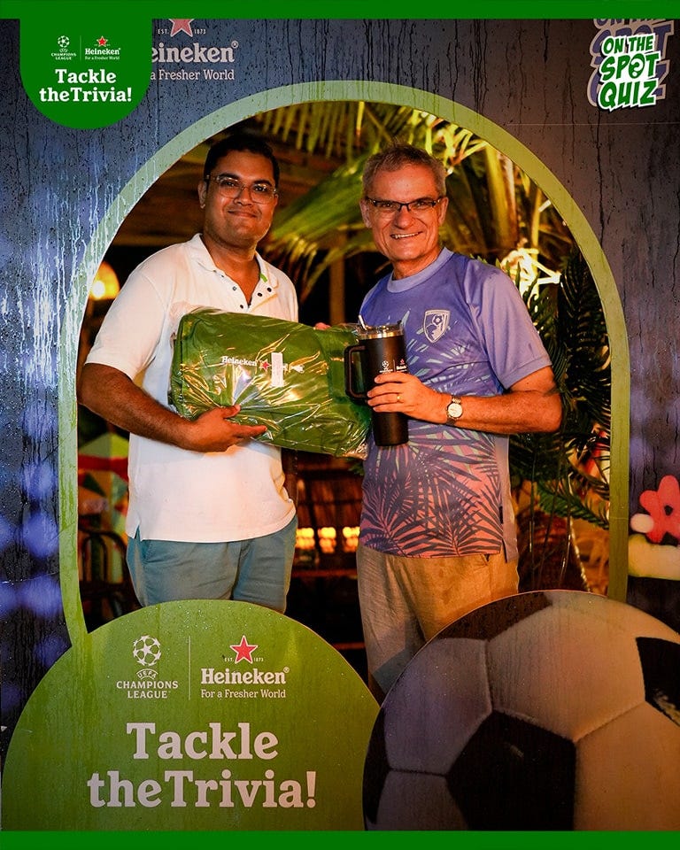 May be an image of 2 people, people playing American football, people playing football and text that says "Helneken® eineken Tackle FresherWorld Fresher World theTrivia! 임NT투 ONITHE SPOT QUIZ ЛepBeKeaT CHMPIONSHeineken CHAMPIONS ศ Heineken LEAGUE Fora Fresher oraFresherWorld World Tackle theTrivia!"
