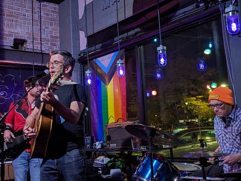 A gallery of people performing at queer open mics over the years