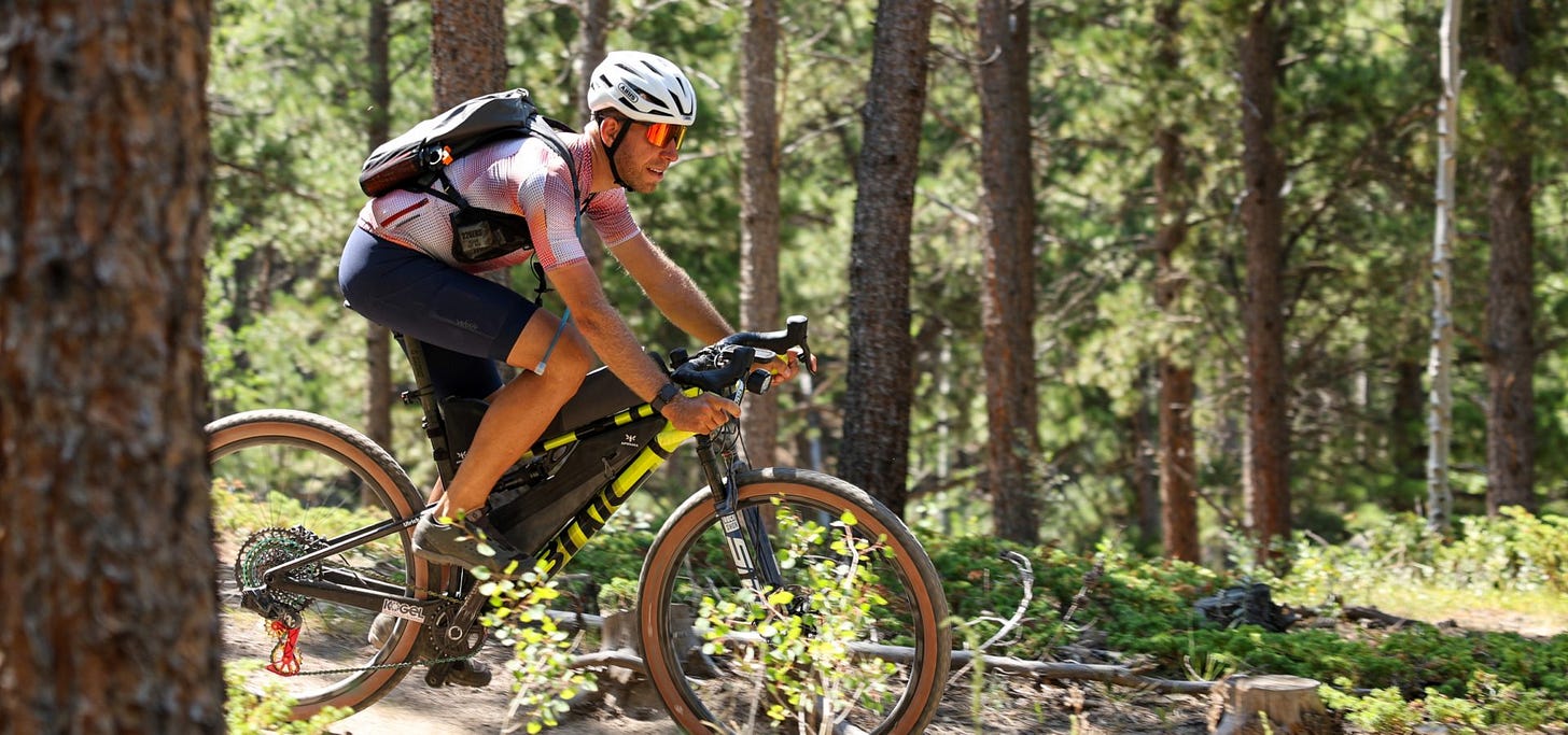 Ulrich Bartholmoes cycling through forest