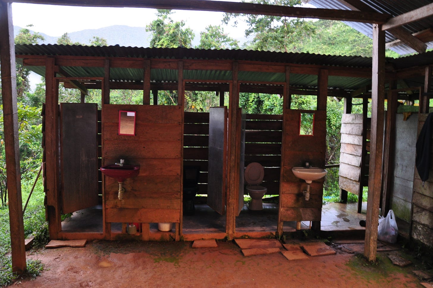 Wooden jungle camp latrines in Colombia Santa Marta mountain trek to Ciudad Perdida lost city.