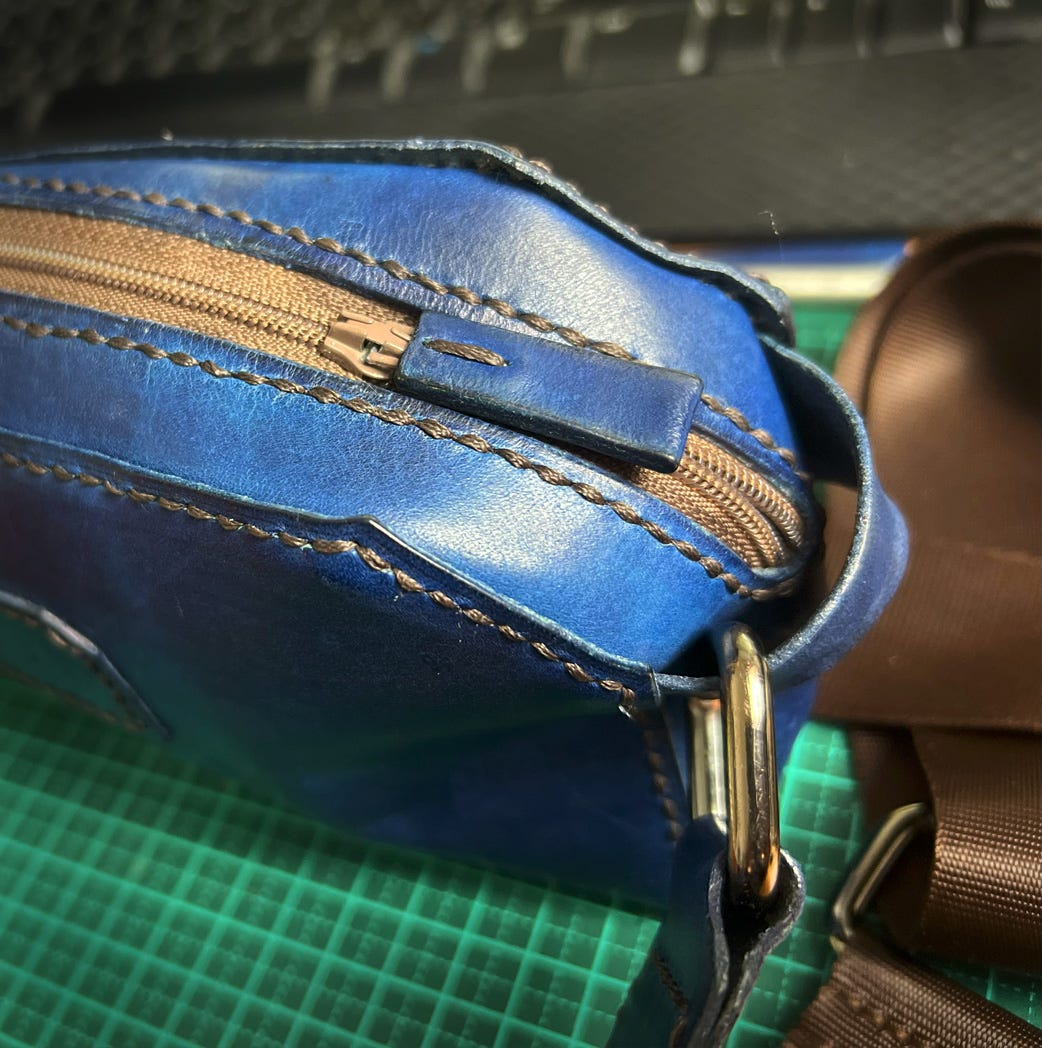 Close up of a leather zipper pull