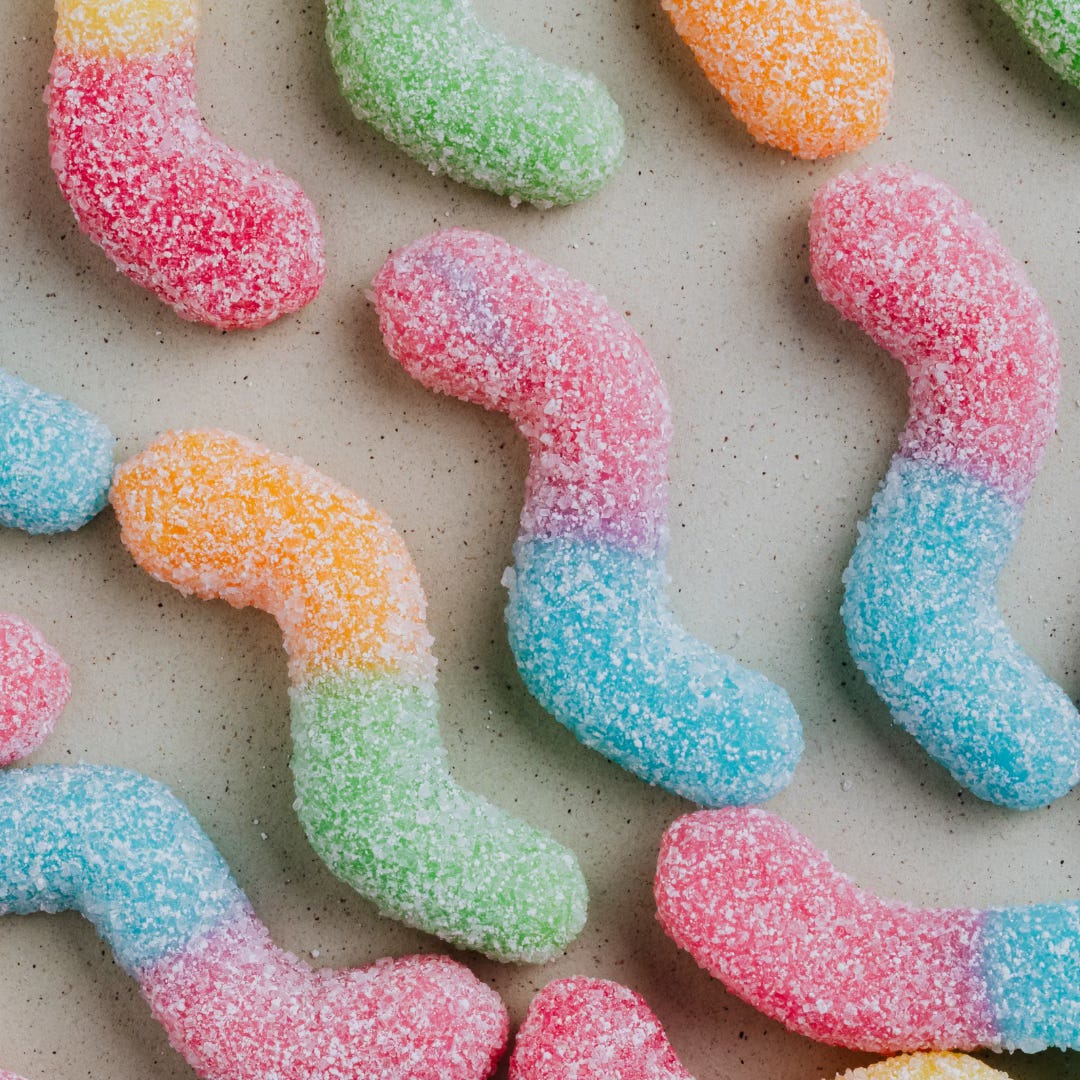 multi-coloured jelly candies lined up in rows