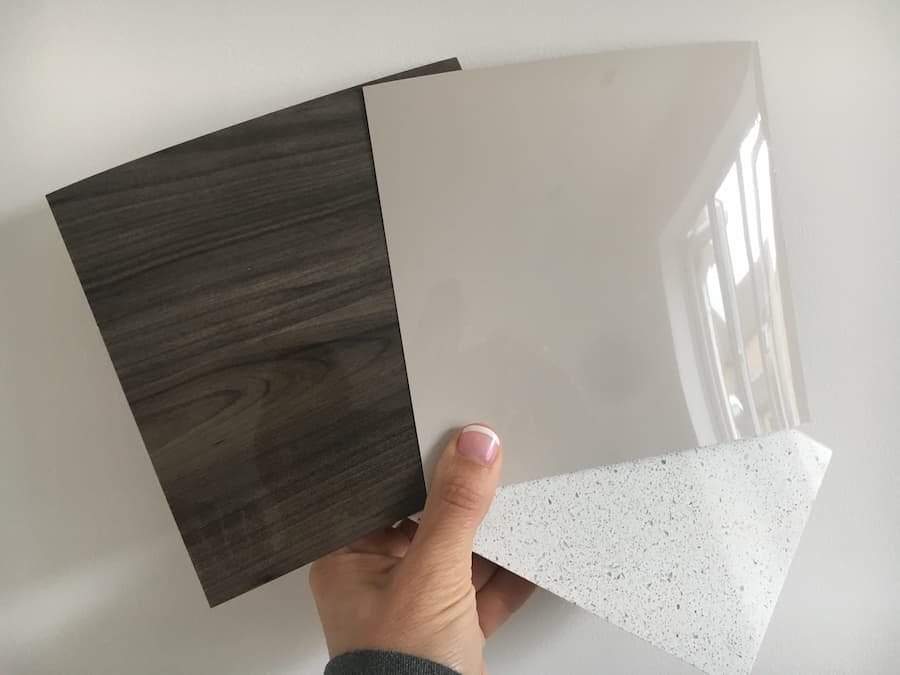 Colour swatches of the kitchen units in walnut gloss and mocha gloss plus a piece of the quartz worktop