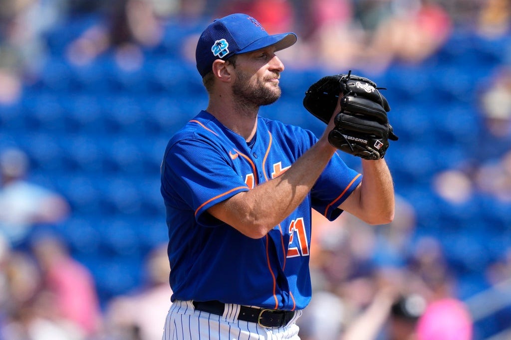 Max Scherzer prepares to throw during the second inning of a spring training game against the Washington Nationals, Friday, March 3, 2023, in Port St. Lucie, Fla.