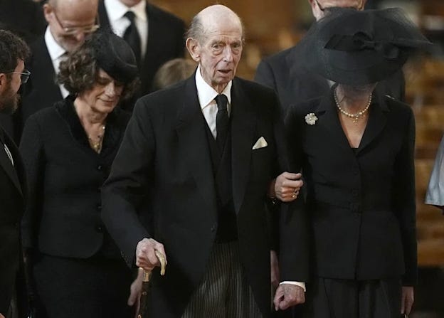 Prince Edward in all black with a walking stick at the funeral