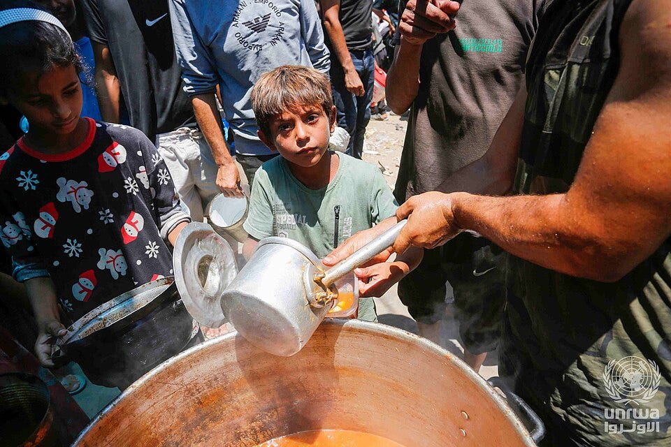 File:Displaced Palestinians gather to receive food from a charity in Deir el-Balah, Gaza Strip.jpg