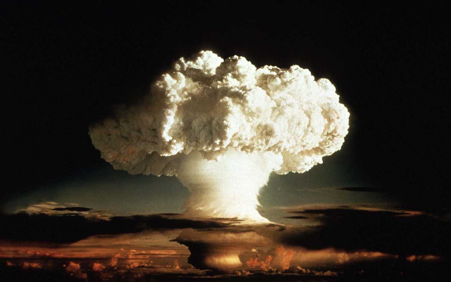 The mushroom cloud of the first test of a hydrogen bomb, "Ivy Mike", as photographed on Enewetak, an atoll in the Pacific Ocean, in 1952, by a member of the United States Air Force's Lookout Mountain 1352d Photographic Squadron. The top secret film studio, then located in Hollywood, California, produced thousands of classified films for the Department of Defence and the Atomic Energy Commission beginning in 1947.