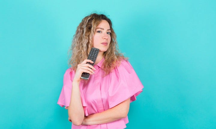 Woman holding remote control