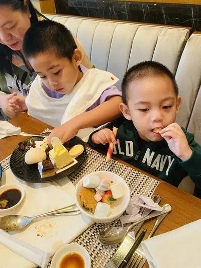 Miguel and Rafa eating sweets at High Street Cafe at Shangri-La The Fort Miguel and Rafa eating sweets at High Street Cafe at Shangri-La The Fort