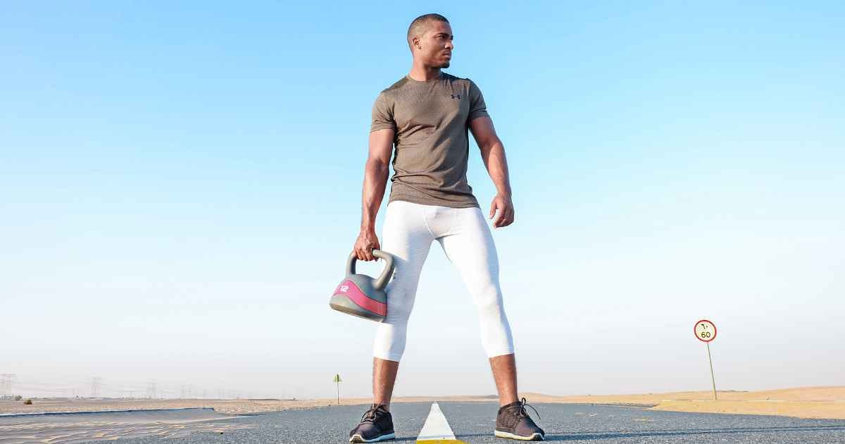 man holding kettlebell