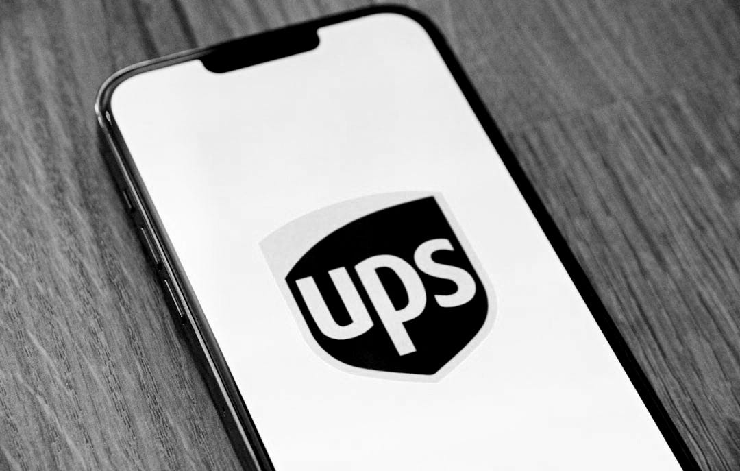 a phone with the ups logo on it a phone with the ups logo on it